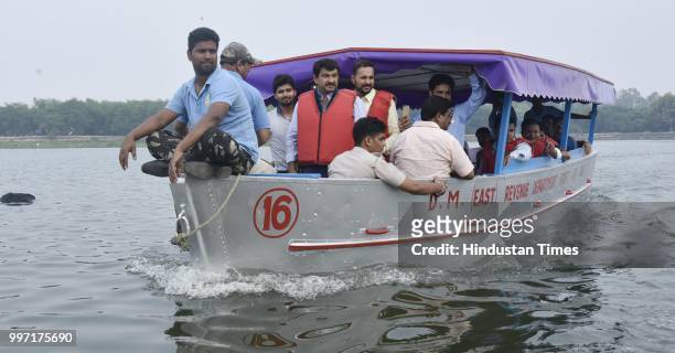 Delhi BJP President Manoj Tiwari along with government officials inspects the proposed water taxi route during his visit to the Yamuna river bank, at...