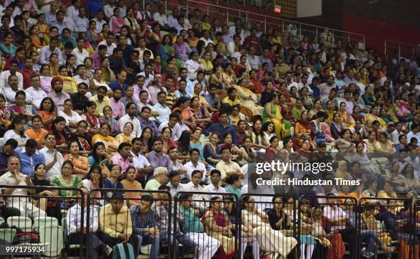 Delhi government school teachers seen during an orientation program on Happiness curriculum, at Thyagraj Stadium on July 12, 2018 in New Delhi,...