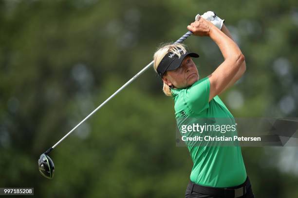 Liselotte Neumann of Sweden plays a tee shot on the ninth hole during the first round of the U.S. Senior Women's Open at Chicago Golf Club on July...
