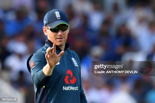 England captain Eoin Morgan gestures during the One Day International cricket match between England and India at Trent Bridge in Nottingham central...