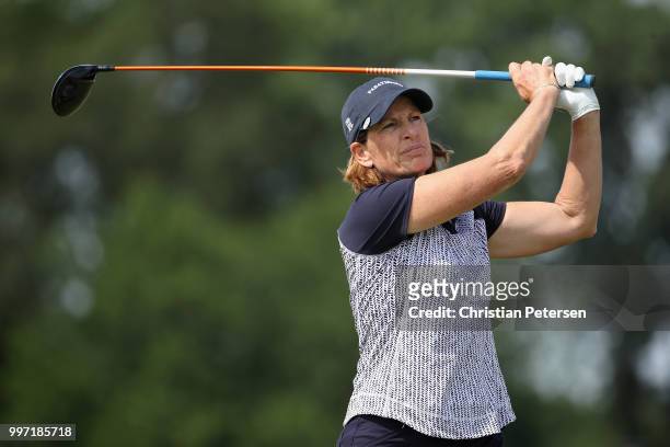 Juli Inkster plays a tee shot on the ninth hole during the first round of the U.S. Senior Women's Open at Chicago Golf Club on July 12, 2018 in...