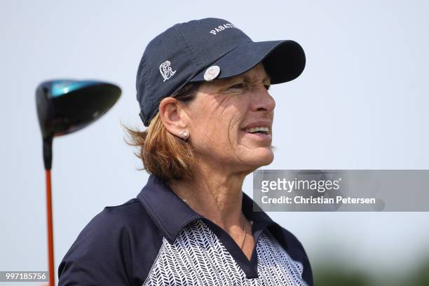 Juli Inkster watches her tee shot on the ninth hole during the first round of the U.S. Senior Women's Open at Chicago Golf Club on July 12, 2018 in...
