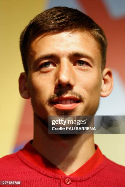 Barcelona´s new player French defender Clement Lenglet gestures at the Camp Nou stadium in Barcelona on July 12, 2018. - Clement Lenglet will join up...