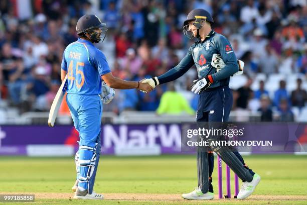 India's Rohit Sharma shakes hands with England's Jos Buttler after India won the One Day International cricket match between England and India at...