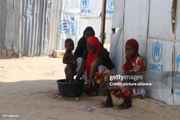 Refugees standing in the Bakassi refugee camp in Maiduguri, Nigeria, 28 June 2017. Millions of people have been displaced by the terrorist militia...