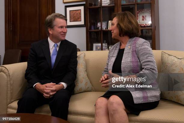 Sen. Deb Fischer greets Judge Brett Kavanaugh as he arrives at her office prior to a meeting in the Russell Senate Office Building on July 12, 2018...