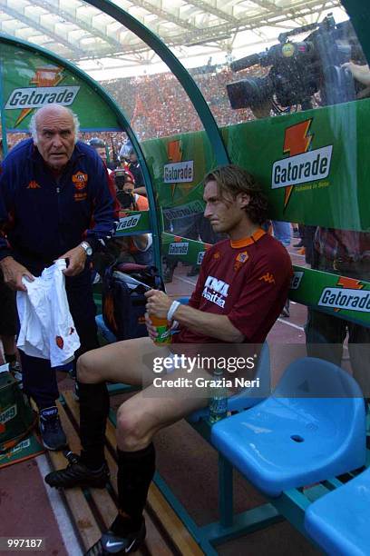 Francesco Totti sits on the bench without his shorts after Roma fans invade the pitch and steal them from him minutes before the end of the Serie A...
