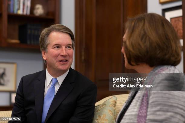 Judge Brett Kavanaugh speaks with Sen. Deb Fischer in her office prior to a meeting in the Russell Senate Office Building on July 12, 2018 in...
