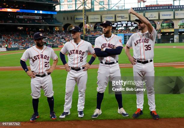 Jose Altuve of the Houston Astros, Alex Bregman, George Springer and Justin Verlander acknowledge the crowd before being presented with their 2018...