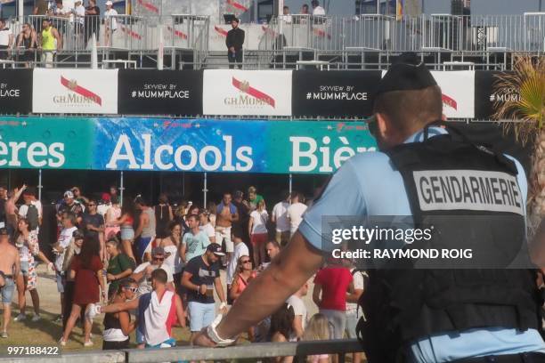 French Gendarme stands during the Electro Beach festival in Barcares, southern France on July 12, 2018.