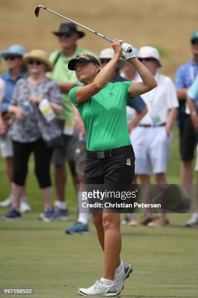 Liselotte Neumann of Sweden plays her second shot on the 15th hole during the first round of the U.S. Senior Women's Open at Chicago Golf Club on...