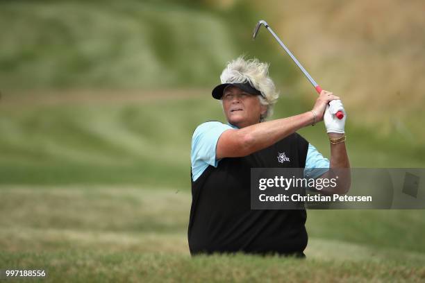 Laura Davies of England plays her second shot on the 15th hole during the first round of the U.S. Senior Women's Open at Chicago Golf Club on July...