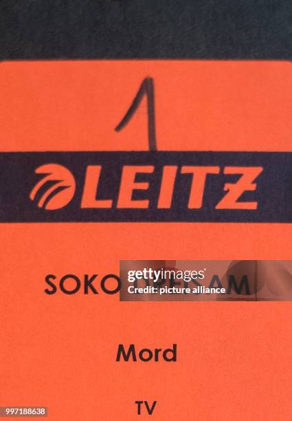 Folder with the inscription "SOKO Dreisam Mord" lying on a table in the courtroom of the District Court in Freiburg, Germany, 12 October 2017. The...