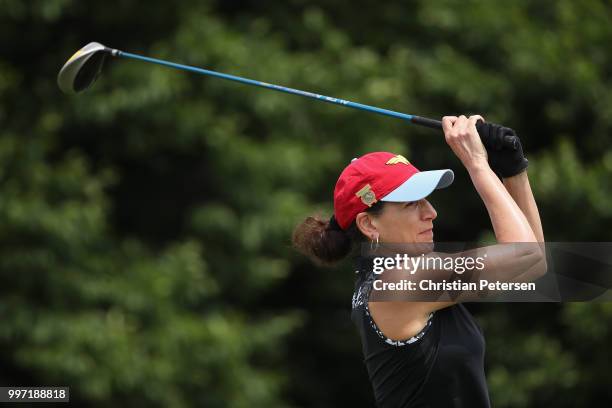 Joanne Foreman plays a tee shot on the first hole during the first round of the U.S. Senior Women's Open at Chicago Golf Club on July 12, 2018 in...