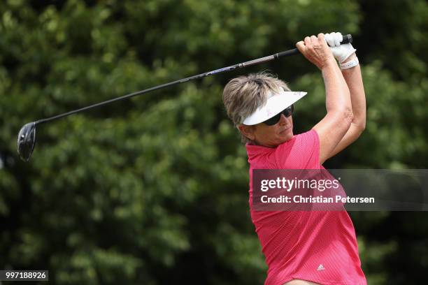 Carolyn Hill plays a tee shot on the first hole during the first round of the U.S. Senior Women's Open at Chicago Golf Club on July 12, 2018 in...