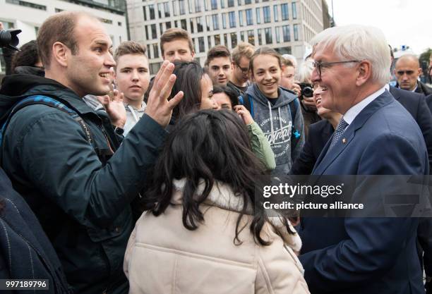 President Frank-Walter Steinmeier greeting spectators at the Pariser Platz in front of the Brandenburg Gate on the occasion of his inaugural official...