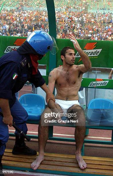 Francesco Antonioli sits on the bench without his kit after Roma fans invade the pitch and steal them from him minutes before the end of the Serie A...