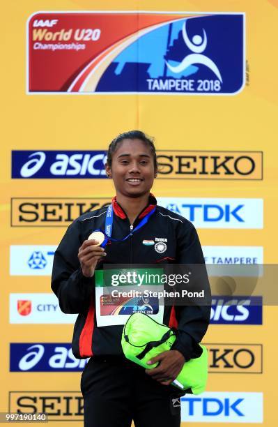 Hima Das of India celebrates with her gold medal during the medal ceremony for the women's 400m on day three of The IAAF World U20 Championships on...