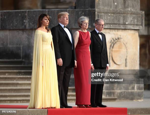 Britain's Prime Minister Theresa May and her husband Philip May greet U.S. President Donald Trump, First Lady Melania Trump at Blenheim Palace on...