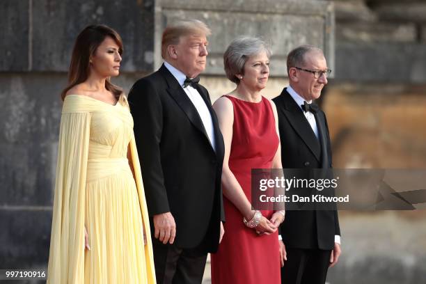 Britain's Prime Minister Theresa May and her husband Philip May greet U.S. President Donald Trump, First Lady Melania Trump at Blenheim Palace on...