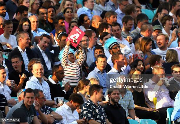 Young fan celebrates a Surrey boundry during the Vitality Blast match between Surrey and Essex Eagles at The Kia Oval on July 12, 2018 in London,...