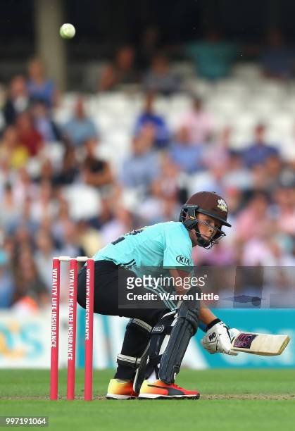 Ollie Pope of Surrey hits a boundry during the Vitality Blast match between Surrey and Essex Eagles at The Kia Oval on July 12, 2018 in London,...