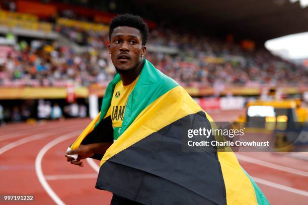 Damion Thomas of Jamaica celebrates after winning gold in the final of the men's 110m hurdles during the XX on day three of The IAAF World U20...