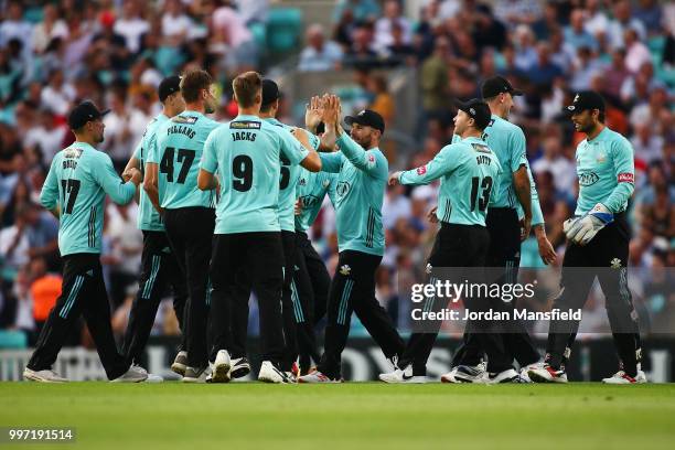 Aaron Finch of Surrey celebrates with his teammates after catching out Adam Wheater of Essex during the Vitality Blast match between Surrey and Essex...