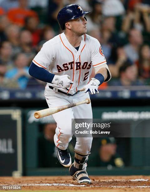 Alex Bregman of the Houston Astros doubles in two-runs in the third inning against the Oakland Athletics at Minute Maid Park on July 12, 2018 in...