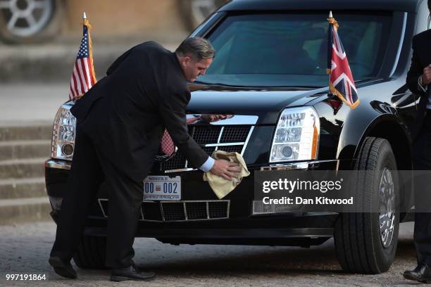 Member of security cleans the limousine of U.S. President Donald Trump and First Lady Melania Trump at Blenheim Palace on July 12, 2018 in Woodstock,...