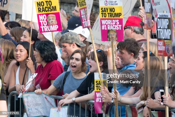 Protesters gather at the gates of Blenheim Palace where U.S. President Donald Trump is attending an evening function in Woodstock on July 12, 2018 in...