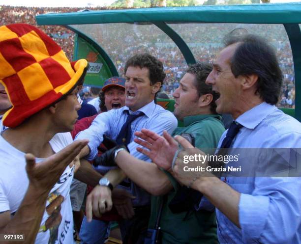 Fabio Capello argues with Roma fans after they invade the pitch minutes before the end of the Serie A 34th Round League match played between Roma and...