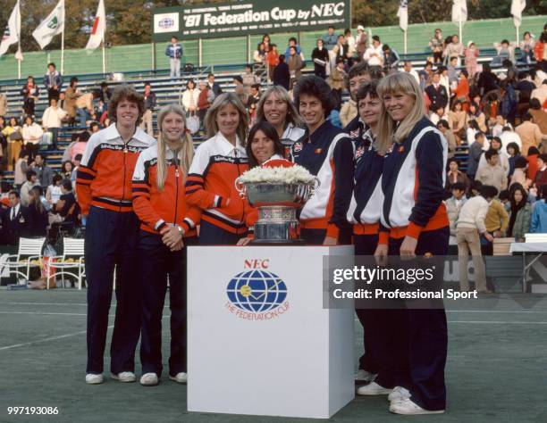 The USA and Great Britain Federation Cup teams pose together with the trophy ahead of the Final at the Tamagawa-en Racquet Club in Tokyo, Japan on...