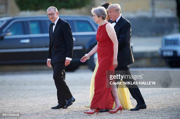 Britain's Prime Minister Theresa May and her husband Philip May greet US President Donald Trump and US First Lady Melania Trump as they arrive for a...