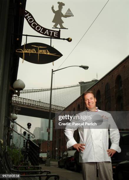 Chef Jacques Torres is photographed in front of his store on July 27, 2004 in Dumbo, New York.
