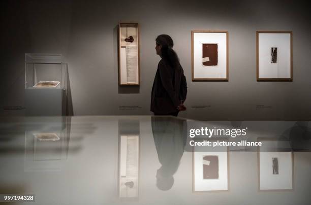 Curator Barbara Strieder stands between works of artist Joseph Beuys in which he used chocolate as working material in the Moyland Castle in...