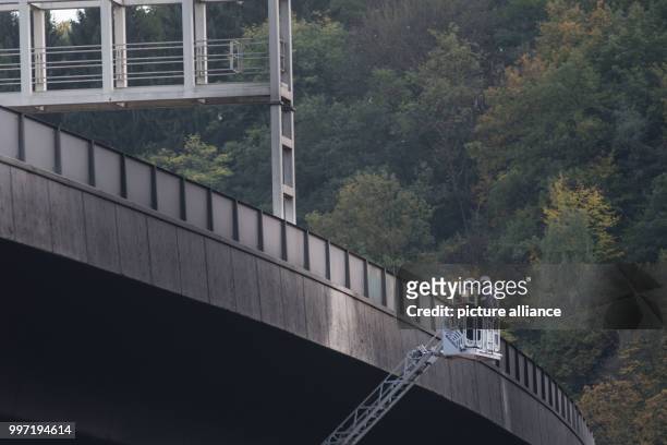 The bridge of the federal highway B62 is being examined after a heavy fire at a neighbouring industrial ground in Siegen, Germany, 12 October 2017....