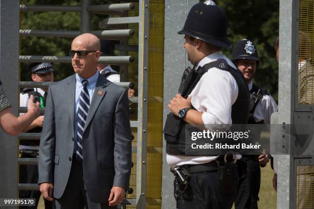 American Secret Service and UK police guard a temporary perimeter fence encircling Winfield House, the official residence of the US Ambassador during...