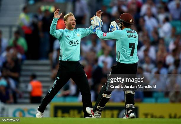 Gareth Batty and Ben Foakes of Surrey celebrates dismissing Ravi Bopara of Essex during the Vitality Blast match between Surrey and Essex Eagles at...