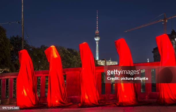 The art installation 'Die Waechter der Zeit' of the light artist Manfred Kielenhofer stand on a bridge across the Spree River during the 'Festival of...