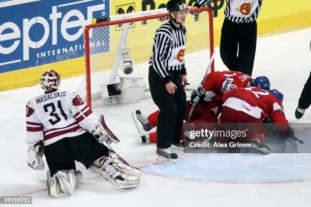 Tomas Rolinek of Czech Republic celebrates his team's first goal with teammates as goalkeeper Edgars Masalskis of Latvia reacts during the IIHF World...