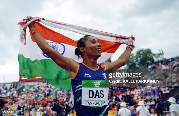Hima Das of India celebrates her victory in women's 400 metres at the 2018 IAAF World U20 Championships in Tampere, Finland, on July 12, 2018. /...