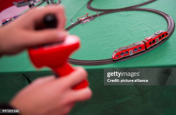 Woman plays with a Maerklin train set during a pre-tour of the event and sales trade show 'infa' in Hanover, Germany, 13 October 2017. 1.400...