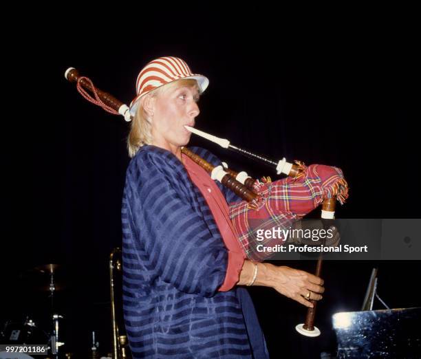 Martina Navratilova of the USA playing the bagpipes at the Players' Party during the Pilkington Glass Tennis Championships at Devonshire Park circa...