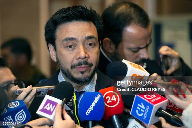 Regional prosecutor Emiliano Arias addresses the press at the Archbishopric of Santiago, on July 12 after requesting the arrest warrant of former...