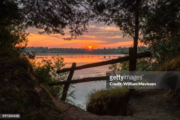 sunrise fence - william mevissen stock pictures, royalty-free photos & images