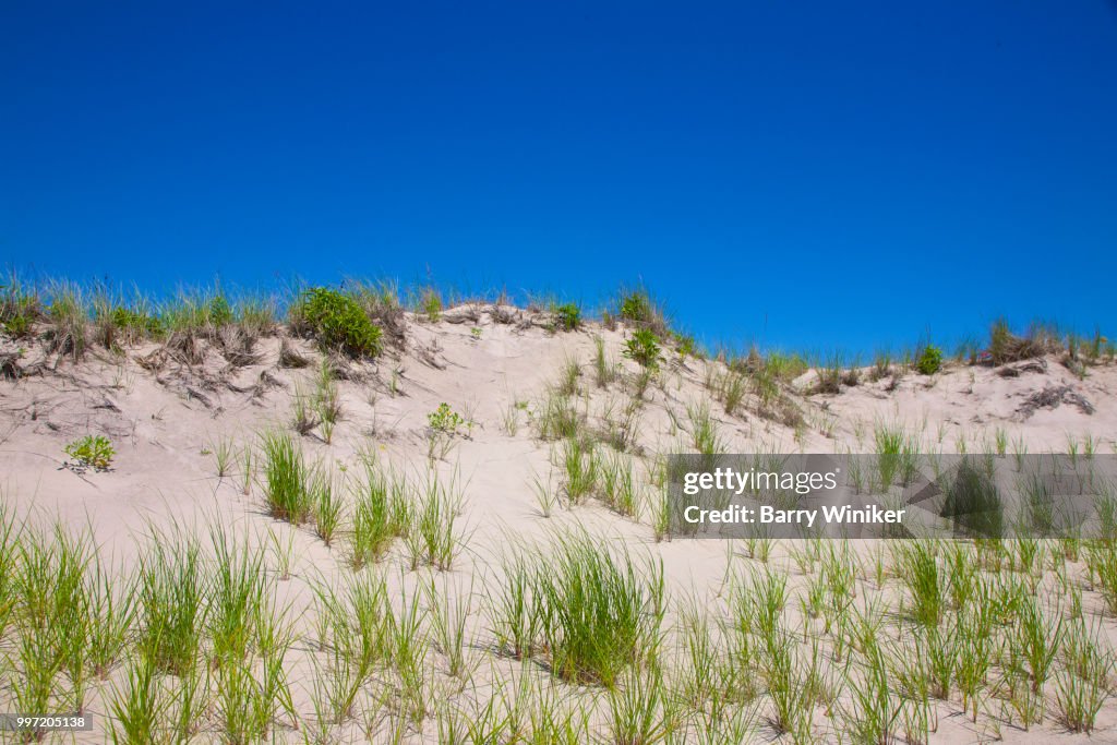 Sand dunes under blue sky at Jones Beach, NY