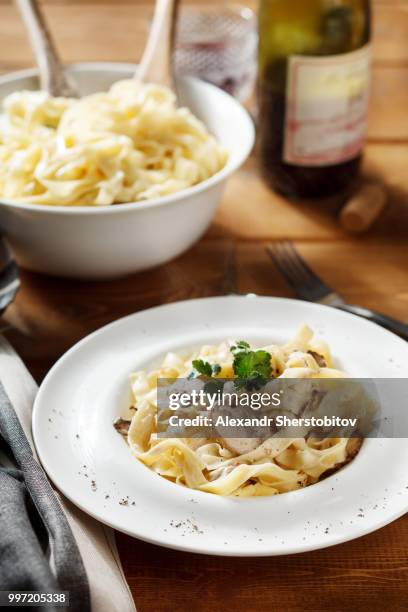 pasta with mushrooms an creame sauce - sherstobitov stock pictures, royalty-free photos & images