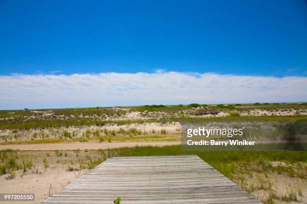 boards facing the sand dunes at jones beach, ny - wantagh fotografías e imágenes de stock