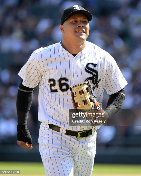 Avisail Garcia of the Chicago White Sox smiles after making a diving catch of a baseball hit by Brian Dozier of the Minnesota Twins on June 28, 2018...